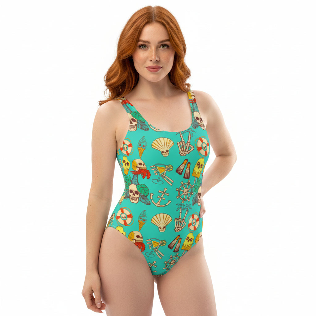 One-piece swimsuit with teal tropical skull, and beach motif print.