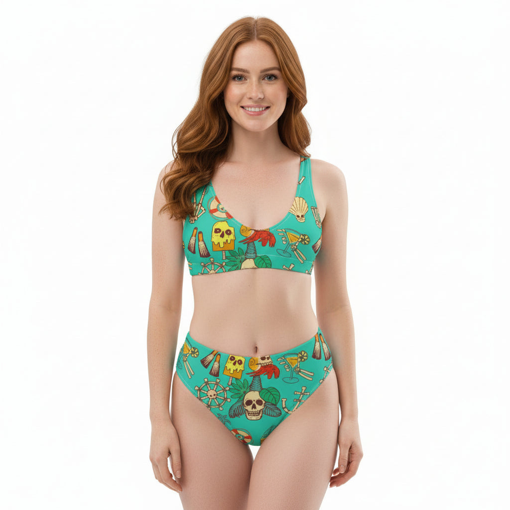 Woman wearing teal high-waisted bikini with white tropical skull and anchor print.