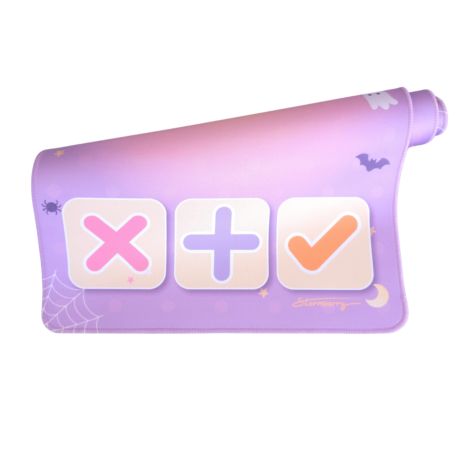 Pastel Halloween XL trade mat rolled up, showing the pink X, plus and check trading tiles