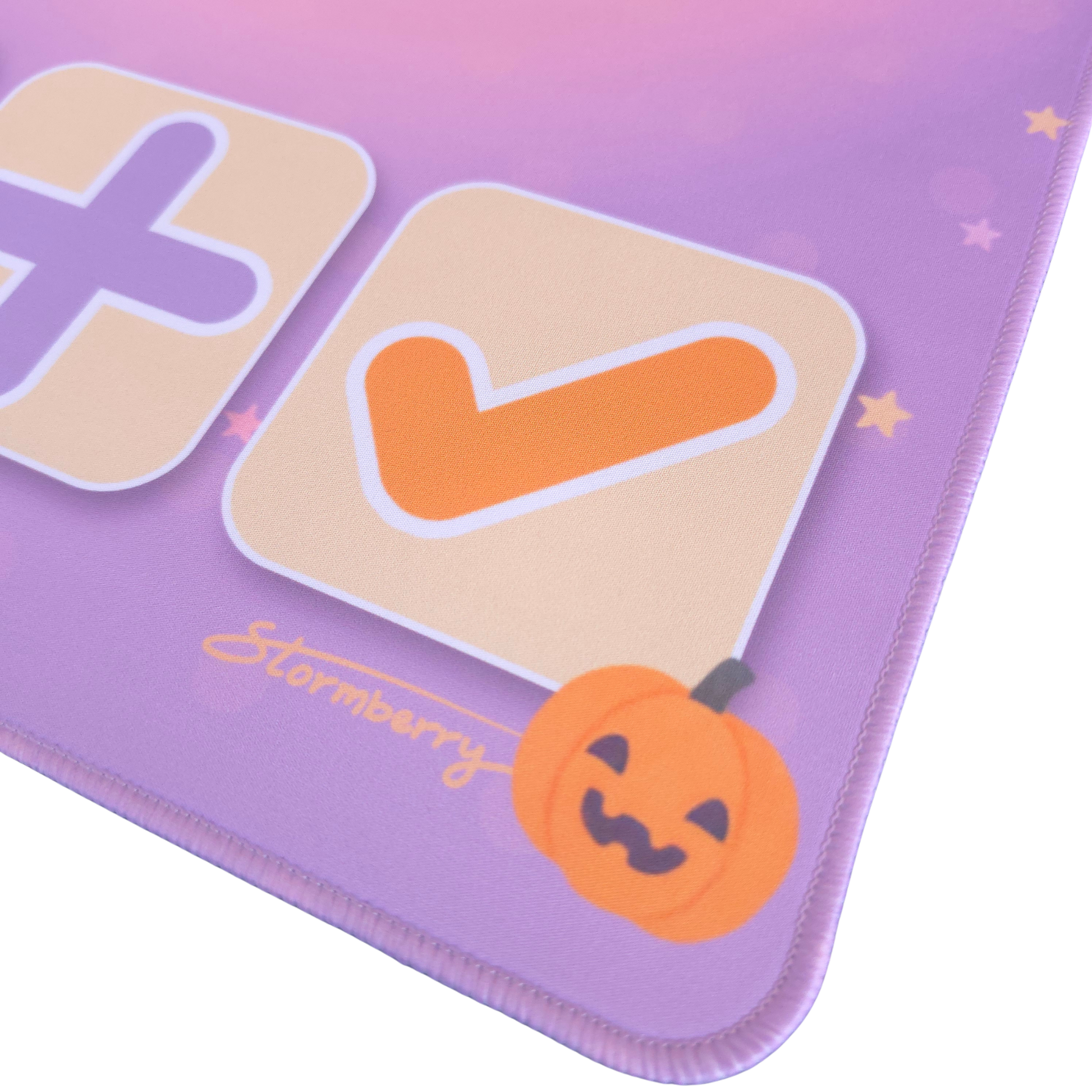 Close up of the orange check tile and little pumpkin art on the Pastel Halloween trade mat