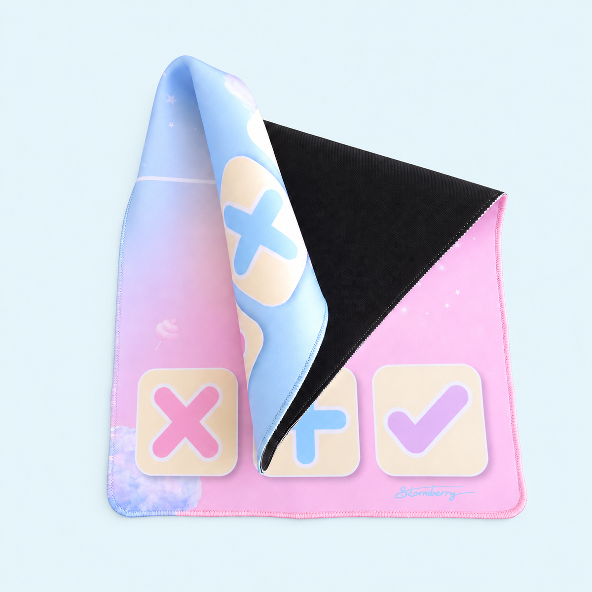 Cotton Candy Cloud mat folded back to reveal its black textured underside and stitched pink and blue edges.