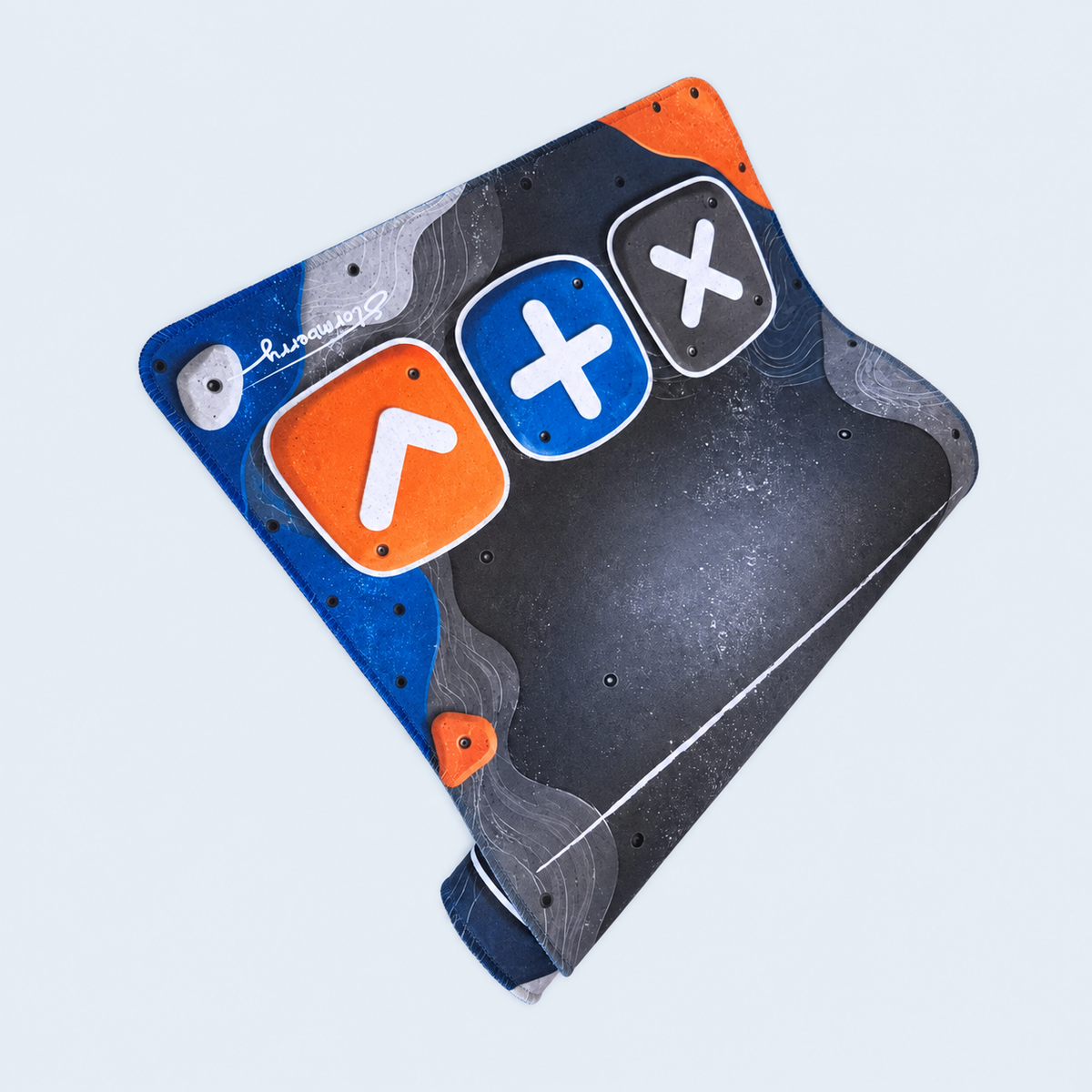 XL Boulder Field trading mat folded to show its blue and orange climbing-hold artwork and stitched edges.
