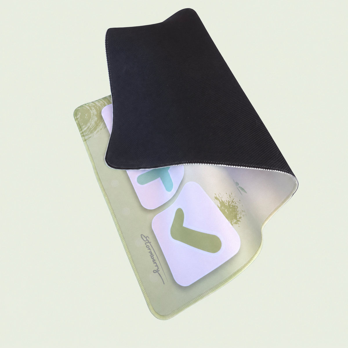 XL Matcha Garden trading mat folded back to show its black rubber backing.