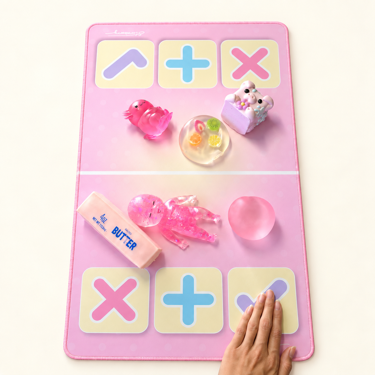 A hand taps the lavender check on a Stormberry trading mat to accept the offer after more toys have been added.