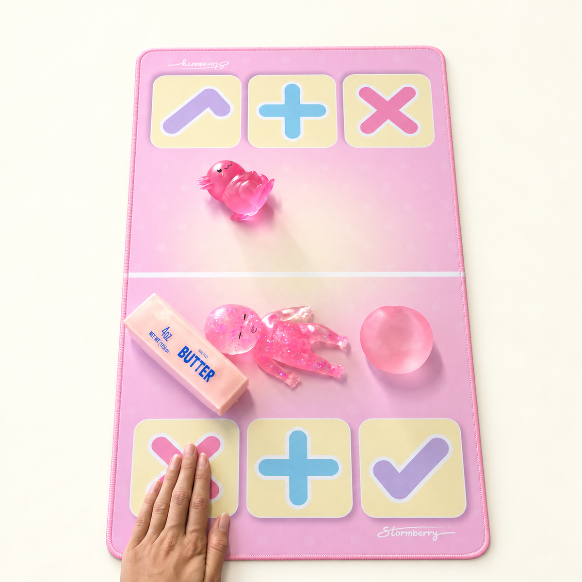 A hand taps the pink X on a Stormberry trading mat to say no thanks to an offer.